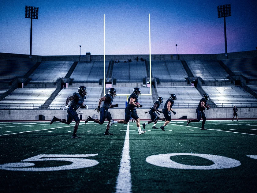 Supporters react to Premier League VAR Decisions on a stadium screen during a top-flight match