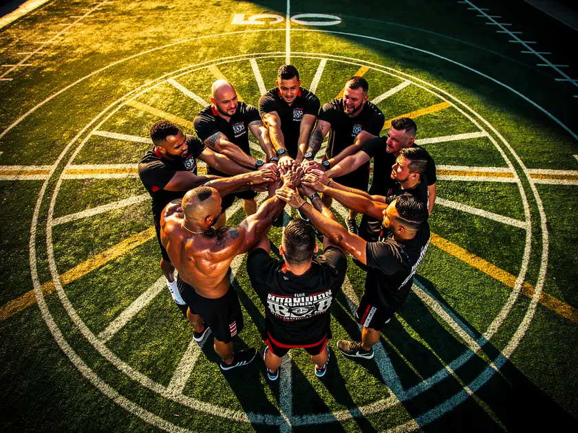 Tom Aspinall holding the UFC interim heavyweight championship belt at a press conference in 2026