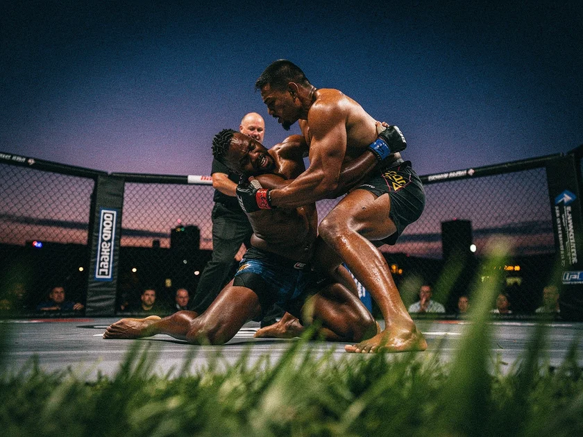 UFC octagon with USADA drug testing signage representing UFC Drug Testing USADA anti-doping protocols in 2026