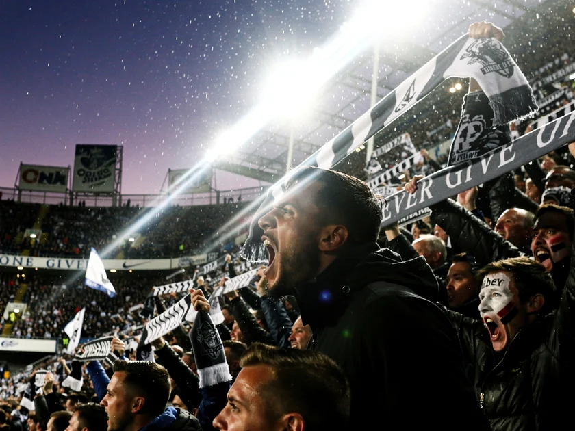 Viktor Gyokeres in Sporting CP kit with Tottenham Hotspur stadium in transfer speculation backdrop 2026
