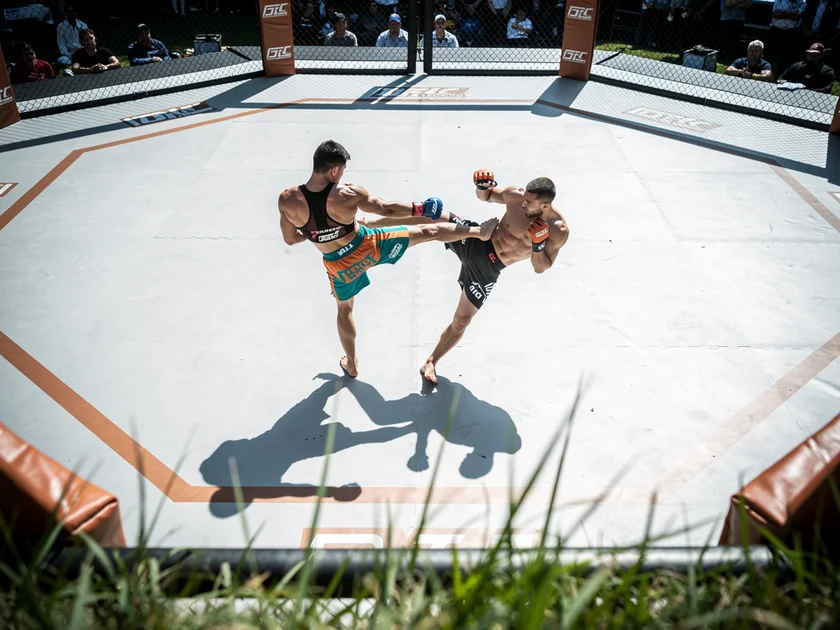 Israel Adesanya in UFC octagon stance preparing for Joe Pyfer middleweight bout in 2026